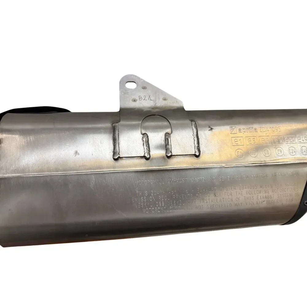 . motorcycle exhaust system, specifically an SC-Project exhaust for an Aprilia